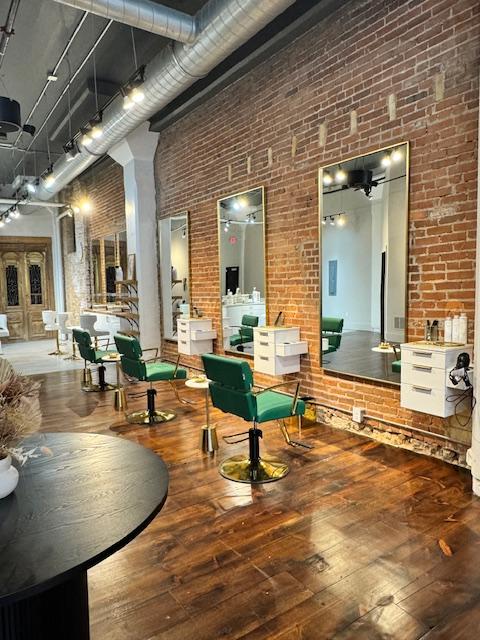 Parella Beauty Co. salon image featuring styling chairs and stations